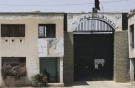File photo of the gate of the prison in Kandahar province, south of Kabul, Afghanistan, May 11, 2008. (Allauddin Khan, The Associated Press)