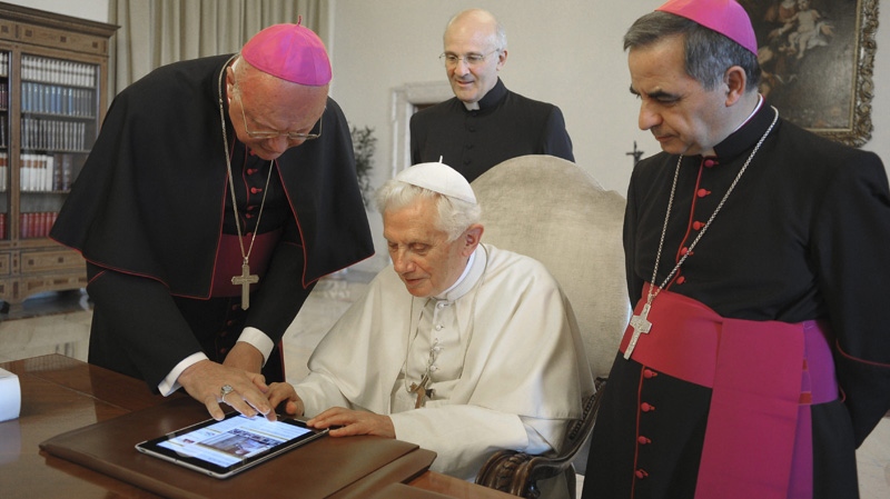 Pope Benedict XVI touches a touchpad to send a tweet for the launch of the Vatican news information portal "www.news.va", at the Vatican Tuesday, June 28, 2011. (AP Photo/Osservatore Romano, HO, File)
