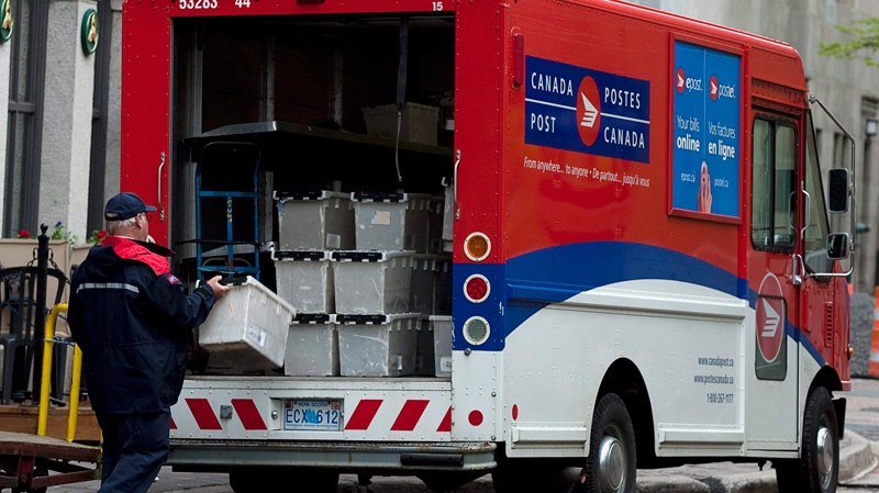 Canada Post says mail should begin trickling into homes and businesses Tuesday, though postal workers will be sorting through a major backlog of mail for the next few days. (Andrew Vaughan / THE CANADIAN PRESS)