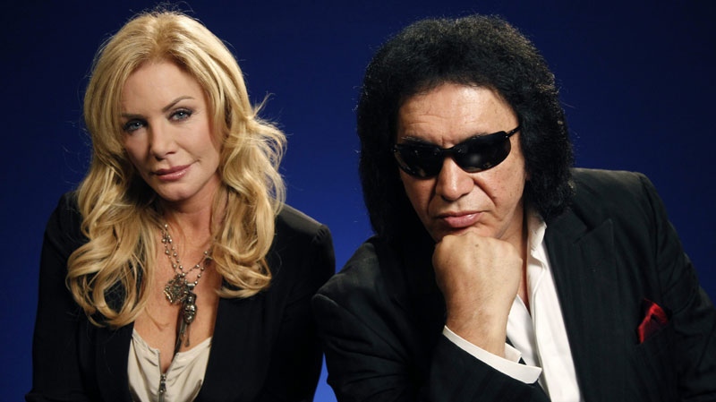 TV personalities Gene Simmons and Shannon Tweed pose for a portrait Monday, June 13, 2011 in New York. Simmons and Tweed star in the TV reality show "Gene Simmons Family Jewels". (AP Photo/Jeff Christensen)