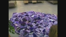 A pile of hand-knitted purple hats is seen at Children's Hospital in London, Ont. on Thursday, Oct. 24, 2013.