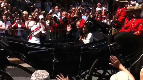 The Duke and Duchess of Cambridge roll down Sussex Drive ina landau Friday, July 1, 2011.