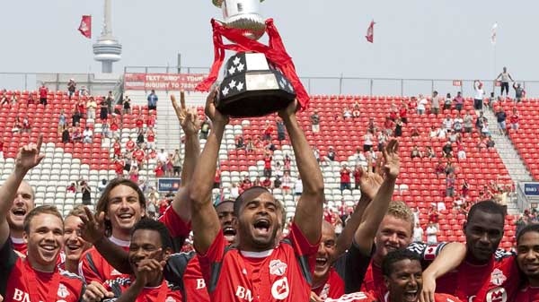 Toronto FC 's captain Maicon Santos lifts the trophy after beating Vancouver Whitecaps' 2-1 to win Nutrilite Canadian Championship in Toronto on Saturday July 2, 2011. (Chris Young / THE CANADIAN PRESS)