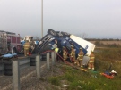 Emergency crews are working to free the driver after a tractor trailer rollover at Provincial Road in Tecumseh, Ont., Tuesday, Oct. 29, 2013. (Adam Ward / CTV Windsor)