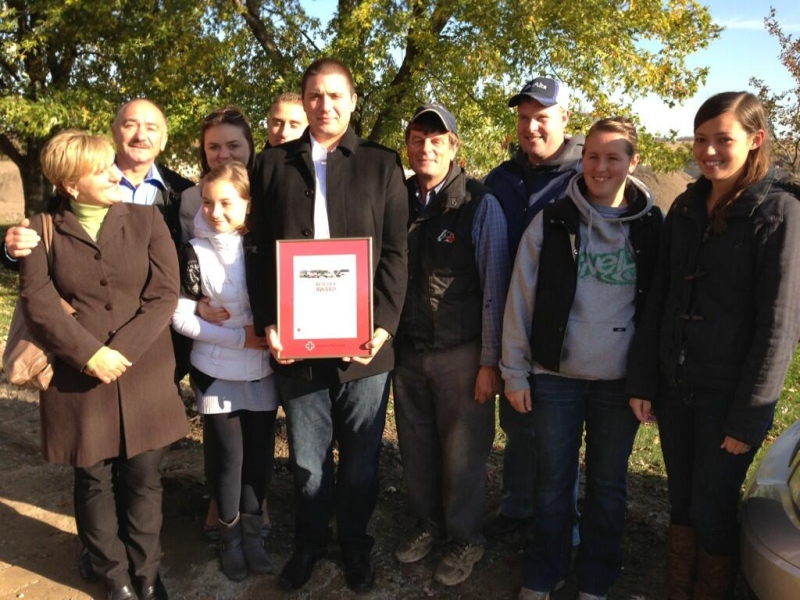 Roman Wasyl Gobosz is surrounded by a thankful family after being presented with an award from the Canadian Red Cross near Woodstock, Ont. on Tuesday, Oct. 29, 2013. (Bryan Bicknell / CTV London)