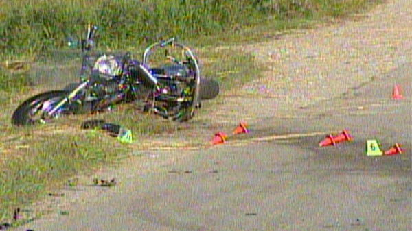 A damaged motorcycle is seen following a fatal crash northeast of Drayton, Ont. on Monday, July 4, 2011.