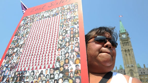 Jacqueline House of Six Nations of the Grand River territory takes part in a rally on Parliament Hill in solidarity with missing and murdered aboriginal women in Ottawa on Tuesday, July 5, 2011. THE CANADIAN PRESS/Sean Kilpatrick