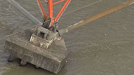 A huge hydro transmission tower toppled into the Fraser River in Surrey, B.C., on July 4, 2011. (CTV)