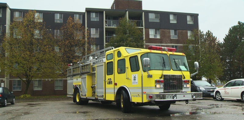 A fire truck sits outside the scene of an apartment fire in Stratford, Ont., on Thursday, Oct. 31, 2013.