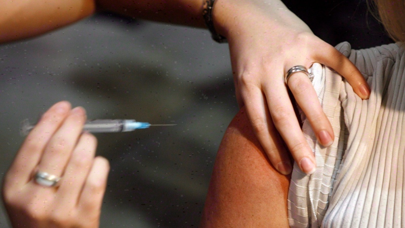 A patient gets a shot during a flu vaccine program. (The Canadian Press/Jeff McIntosh)