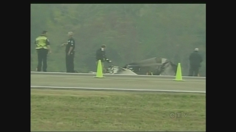 Officials work at the scene of a plane crash in Nashville, Tenn. that killed a Windsor pilot.
