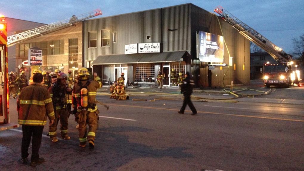 Firefighters putting out flames at Café Creole