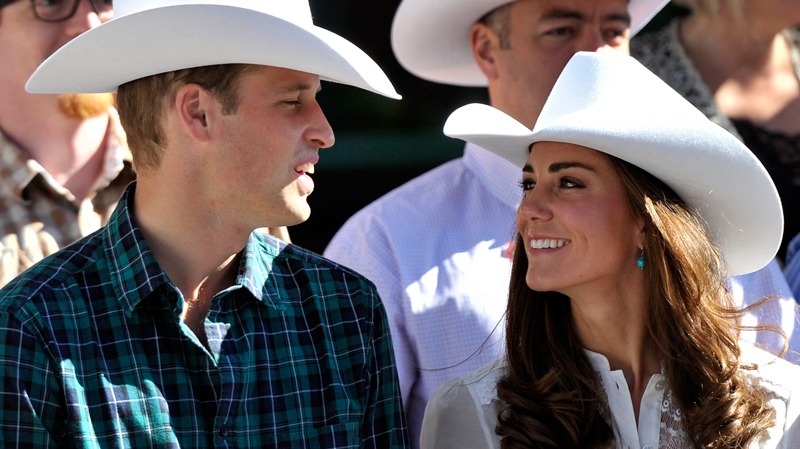 The Duke and Duchess of Cambridge watch the annual Calgary Stampede parade in Calgary Alta., on Friday, July 8, 2011. (Nathan Denette / THE CANADIAN PRESS)  
