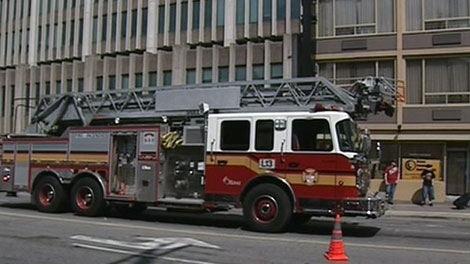 Firefighters respond to a blaze that started in a dryer at the Days Inn on Rideau Street in downtown Ottawa, Friday, July 8, 2011.