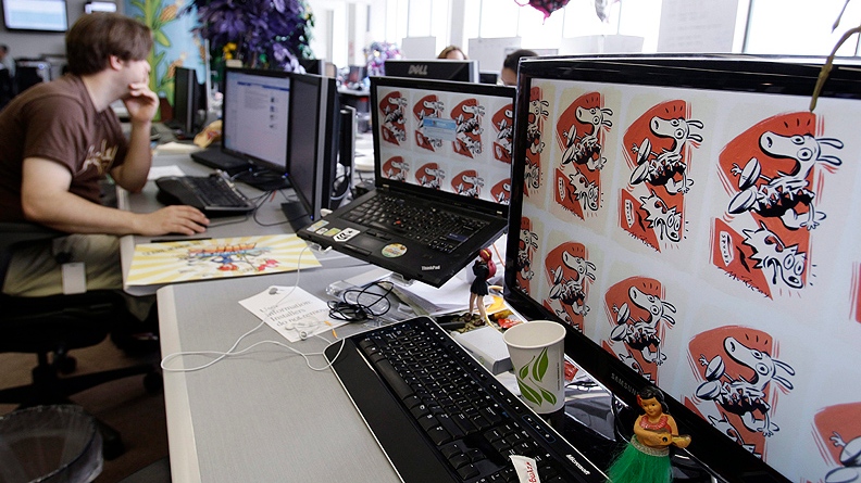 In this June 2, 2011 photo, an employee works on the Zynga game, "FarmVille" at Zynga headquarters in San Francisco. Based on papers filed Friday, July1, 2011, Zynga, the online game maker behind "FarmVille" and other popular Facebook pastimes, is going public. (AP Photo/Paul Sakuma)