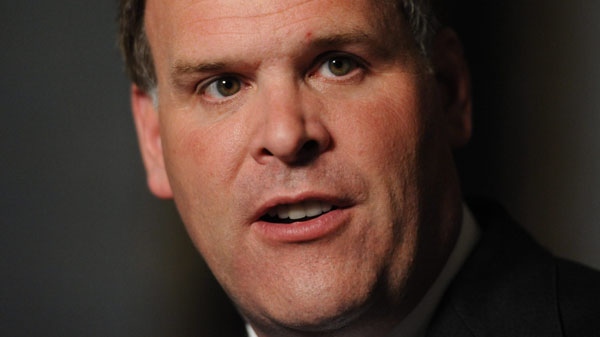 Minister of Foreign Affairs John Baird speaks to reporters in the Foyer of the House of Commons on Parliament Hill in Ottawa on Tuesday, July 5, 2011. (Sean Kilpatrick / THE CANADIAN PRESS)