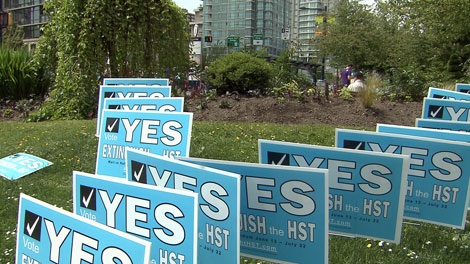 Signs from the anti-HST campaign sign are seen in Vancouver in this CTV file image.