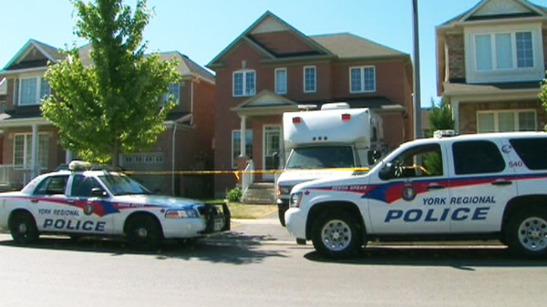 Peel Regional Police investigate after recovering a body from the basement of this Markham home on Thursday, July 14, 2011.