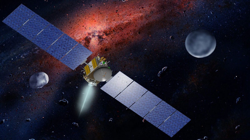 This undated artist's concept released by NASA and UCLA shows the Dawn spacecraft with Ceres and Vesta. After four years sailing through space, the Dawn spacecraft was expected to slip into orbit late Friday around a giant asteroid Vesta to begin a yearlong investigation into the origins of the solar system. 