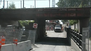This overpass will be demolished, the road widened and lowered, and a new overpass will be built. (July 15, 2011)