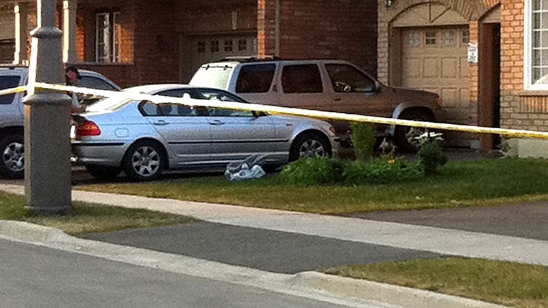 Police investigate after a toddler was struck and killed by a car in Brampton, Ont. on Saturday July 16, 2011. (Kyle Christie / CTV News)