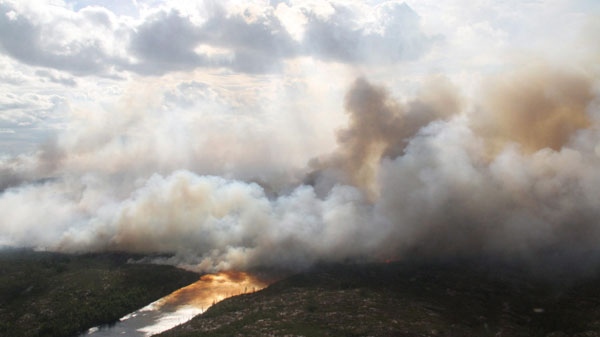 A forest fire burns Friday, July 15, 2011 about 270 kilometres north northeast of Sioux Lookout, Ont. THE CANADIAN PRESS/ho-Ontario Ministry of Natural Resources-Mitch Miller