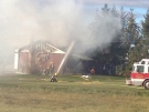 Crews work to extinguish a fire on Cherryhill Road in the Municipality of Thames Centre on Tuesday, Nov. 19, 2013. (Gerry Dewan / CTV London)