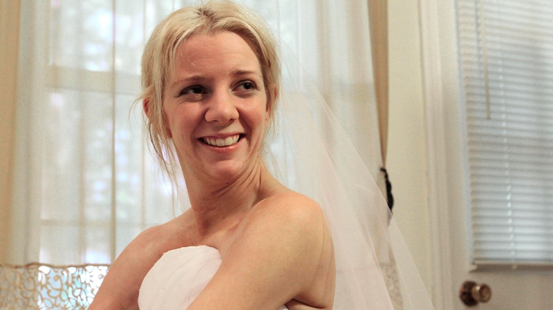 In this June 30, 2011 photo, Rachelle Friedman smiles after trying on her wedding dress in Raleigh, N.C. (AP / Gerry Broome)