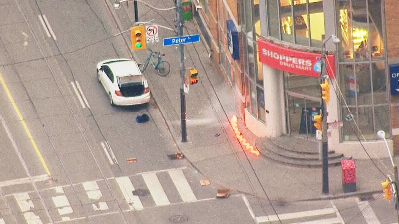 Toronto police detonate an incendiary device in downtown Toronto, Tuesday, Nov. 19, 2013. 