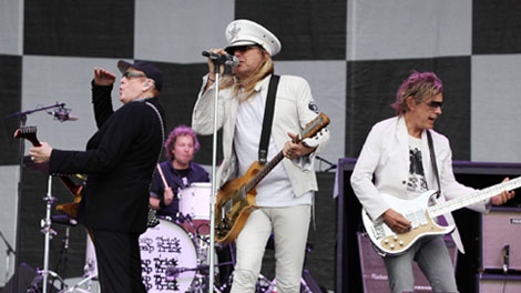 Rick Nielsen (left to right), Bun E. Carlos, Robin Zander and Tom Petersson of the band Cheap Trick perform at the Cisco Ottawa Bluesfest on Sunday, July 17, 2011. The band fled the stage moments before it collapsed. THE CANADIAN PRESS/Ottawa Bluesfest/Patrick Doyle