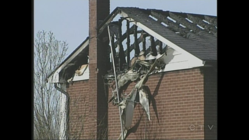 The damage to a home following a fatal fire is seen in Thames Centre, Ont. on Wednesday, Nov. 20, 2013.