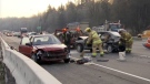 Emergency crews clean up debris after a major accident along Highway 1 that crippled westbound traffic on the major commuter route. Nov. 21, 2013. (CTV)