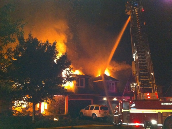 Fire crews try to put out a massive house fire on Creekwood Crescent in Ottawa's Crystal Beach neighbourhood, Wednesday, July 20, 2011. Viewer photo submitted by: Robert Lacasse