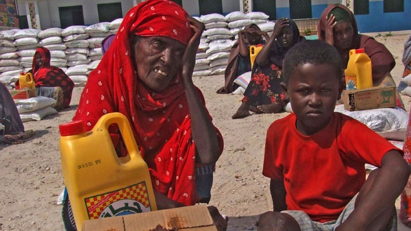 An old Somali woman displaced by drought, waits next to rations at a camp in Mogadishu, Somalia, Wednesday, July 20, 2011. (AP / Mohamed Sheikh Nor)