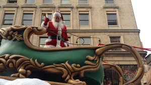 Santa Claus visits at the annual parade in his honour, Saturday, Nov. 23, 2013 (CTV Montreal / Kevin Gallagher)