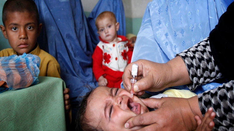 An Afghan child receives a vaccination during a polio eradication campaign at a health clinic in Jalalabad, Afghanistan, Sunday, March 13, 2011.