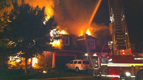 Fire crews try to put out a massive house fire on Creekwood Crescent in Ottawa's Crystal Beach neighbourhood, Wednesday, July 20, 2011. Viewer photo submitted by: Robert Lacasse