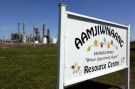 A sign for the Aamjiwnaang First Nation Resource Centre is located across the road from NOVA Chemicals in Sarnia, Ont., on April 21, 2007. A new study has shed light on the health problems facing a First Nations community living near one of Canada's most industrialized areas. (Craig Glover / THE CANADIAN PRESS)