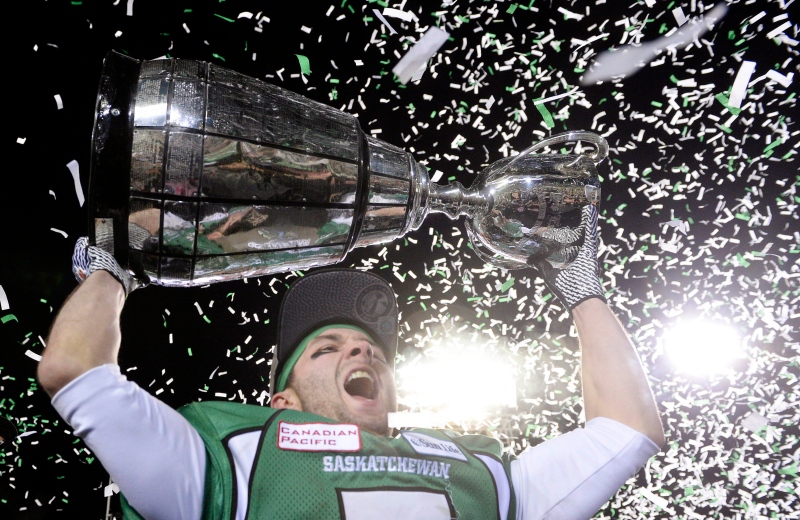 Saskatchewan Roughriders slotback Weston Dressler hoists the cup after beating the Hamilton Tiger-Cats in the Grey Cup, Sunday, November 24, 2013 in Regina. THE CANADIAN PRESS/Frank Gunn