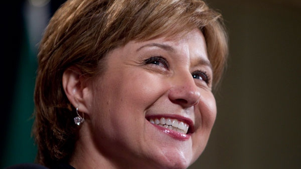 British Columbian Premier Christy Clark smiles as she speaks to the media following a meeting of the Council of the Federation in Vancouver, Thursday, July 21, 2011. (Jonathan Hayward / THE CANADIAN PRESS)