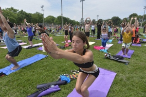 Over a thousand Canadians take part in a Canada Loves Yoga event in Toronto Saturday, July 6, 2013. (The Canadian Press Images PHOTO/Yahoo! Canada)