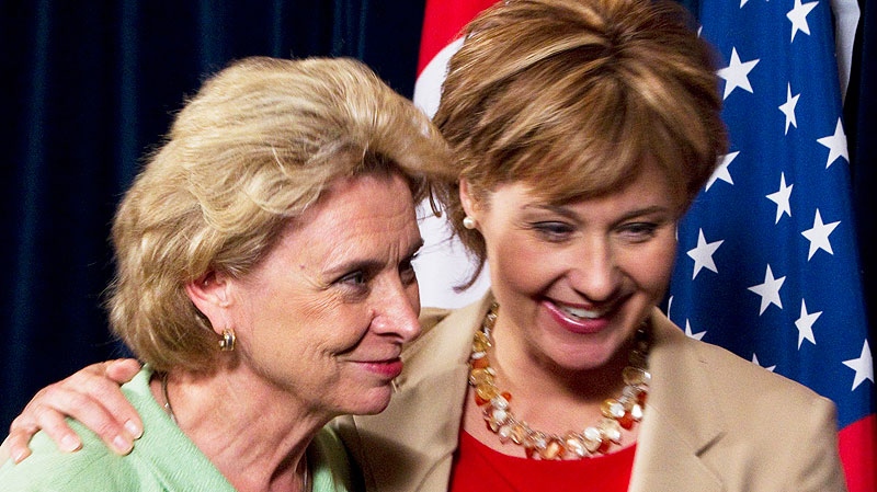 British Columbia Premier Christy Clark, right, puts her arm around Washington state Gov. Christine Gregoire, left, in Vancouver, British Columbia, Canada on Friday, July 22, 2011. (AP / The Canadian Press, Jonathan Hayward)