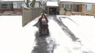 Ayesha Zubair steers her electric wheelchair down her Scarborough driveway on Wednesday, Nov. 27, 2013. 