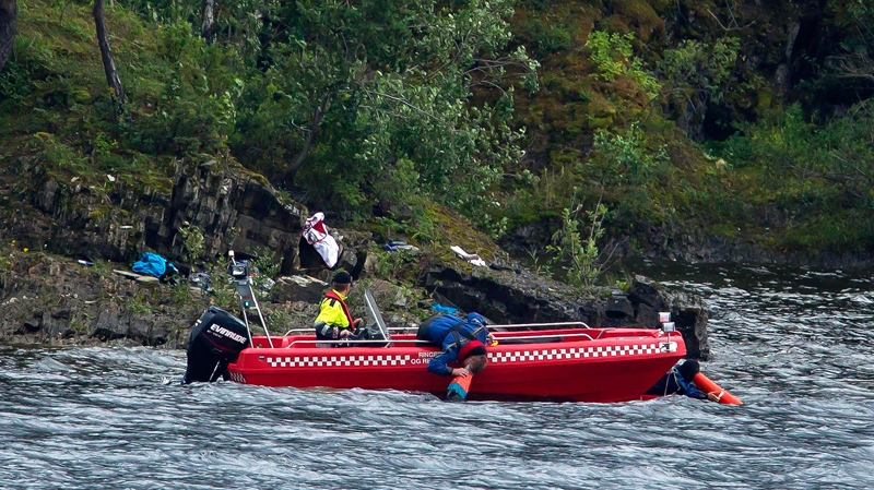 Emergency workers search for bodies beneath the water off the island of Utoya, Saturday, July 23, 2011. (AP / Matt Dunham)