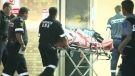 A male victim is taken to hospital following a double shooting in Toronto's east end on Saturday, July 23, 2011.