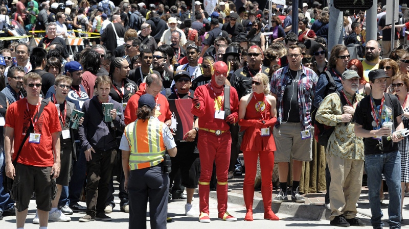 Crowds arrive at Comic-Con International 2011 convention held in San Diego Saturday, July 23, 2011. (AP Photo/Denis Poroy)