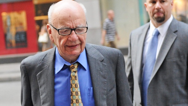 News Corporation head Rupert Murdoch enters the News Corp. building, Friday, July 22, 2011, in New York. (AP Photo/Louis Lanzano)