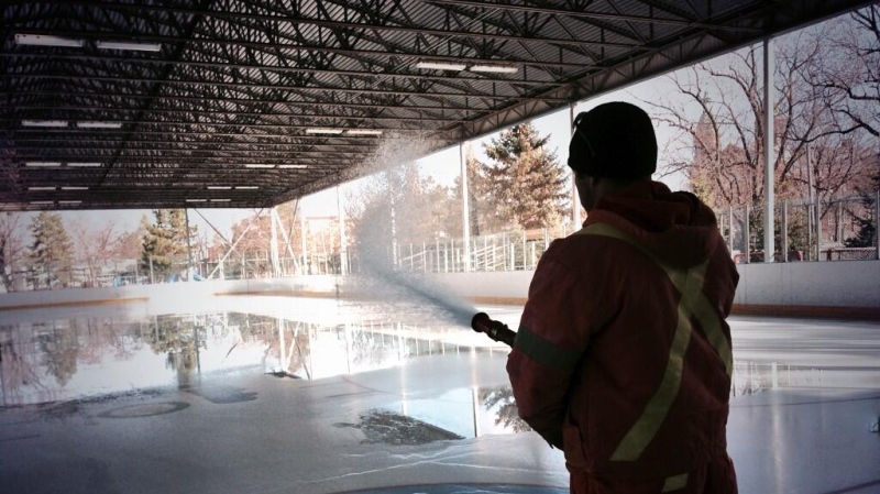 A City of Windsor worker sprays down Lanspeary Lions Rink Friday, Nov. 29. (Sacha Long/ CTV Windsor)