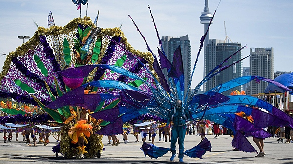 Revelers take part in the 2010 Caribana Parade in Toronto on Saturday, July 31, 2010. (THE CANADIAN PRESS/Adrien Veczan)