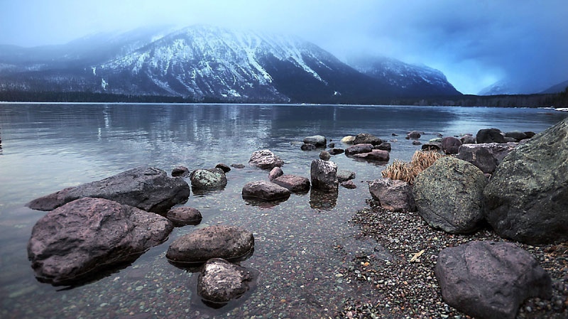 In this Monday April 4, 2011 photo, a storm begins to roll in from the east over Lake McDonald at sunrise in Glacier National Park, Mont. (AP Photo/The Daily Inter Lake, Brenda Ahearn)